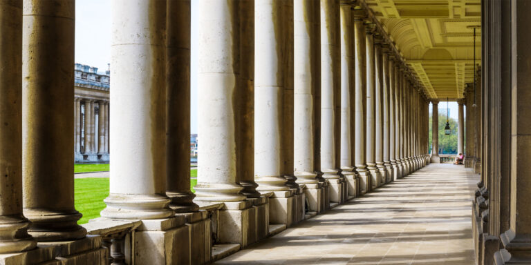 picture of a hallway with a bunch of marble columns