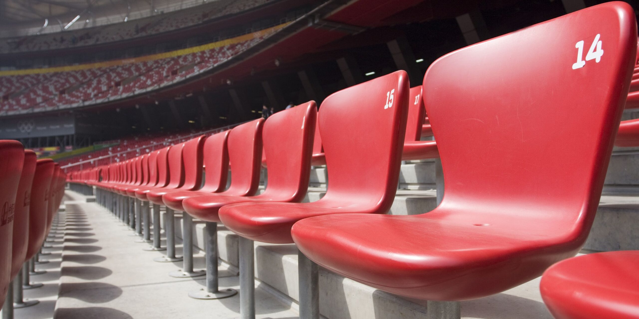 Picture of an upclose row of chairs in a theatre